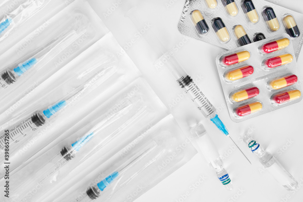 Pills and syringes Pills and syringes