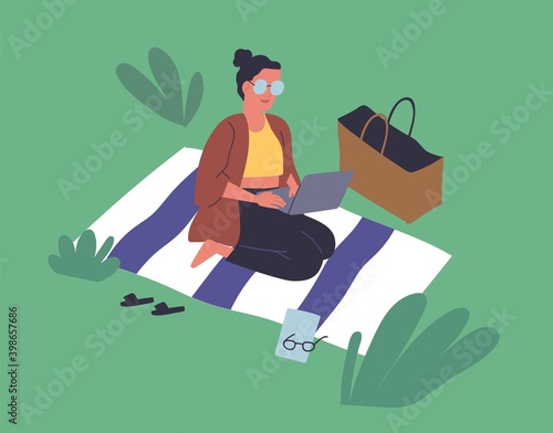 Happy young woman sitting on blanket in park and surfing internet. Freelancer working on laptop outdoors. Scene of summer recreation and remote work. Flat vector cartoon illustration