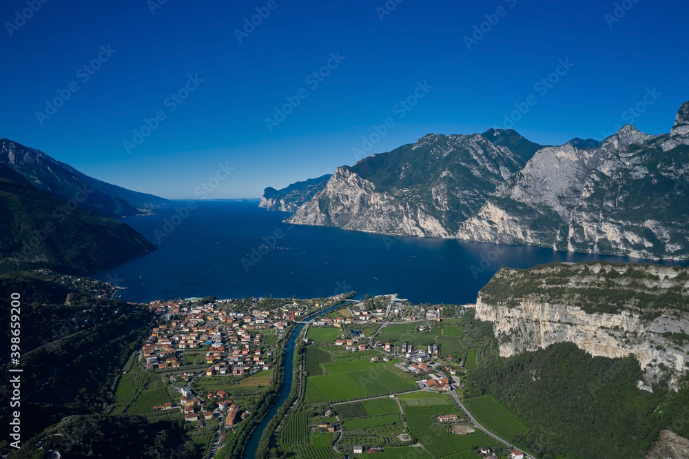 Fototapeta premium Italy panoramic view of the Torbole, town Riva del Garda and lake Garda. Aerial view