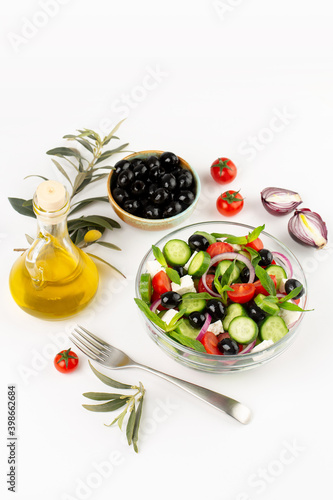 Olives and olive oil and vegetable salad in studio