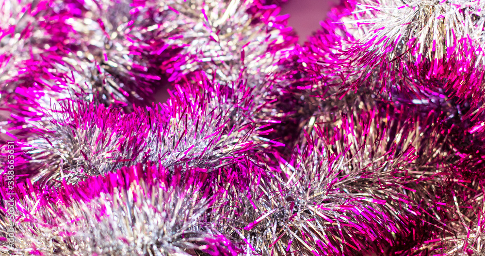 Pink Christmas tree tinsel. Christmas and New Year . Decoration for the holiday. Pink Christmas tree tinsel. Christmas and New Year . Decoration for the holiday.