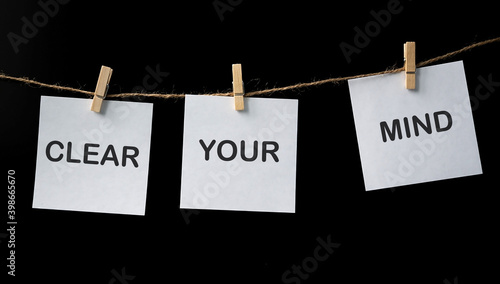 Three bookmark stickers with the word clear your mind on a black background photo