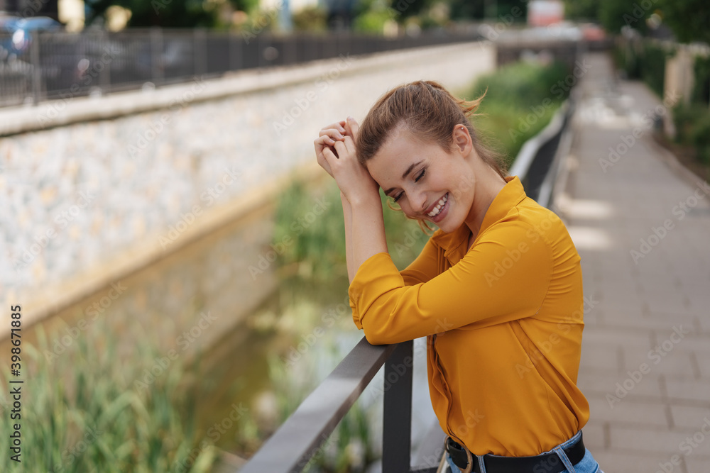 Cute happy young woman smiling to herself Cute happy young woman smiling to herself
