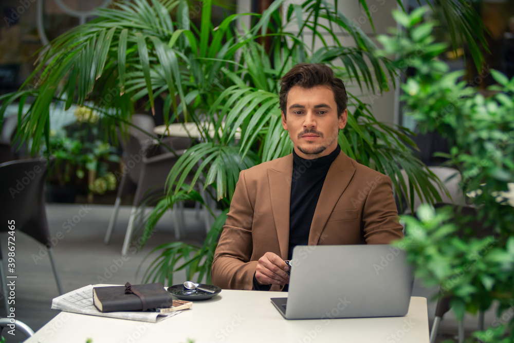 businessman sitting at a computer businessman sitting at a computer
