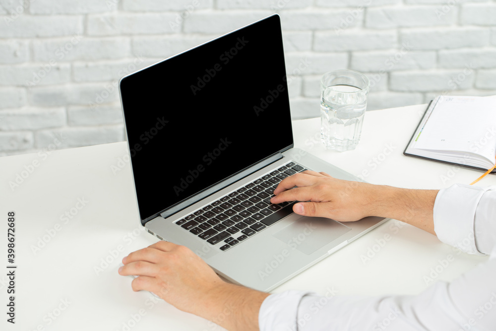 Man in white shirt working on laptop Man in white shirt working on laptop