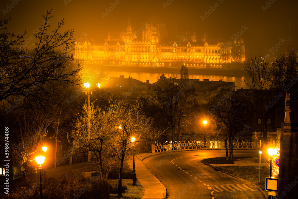 Hungarian parliament at Danube river seen across the fog. Budapest 