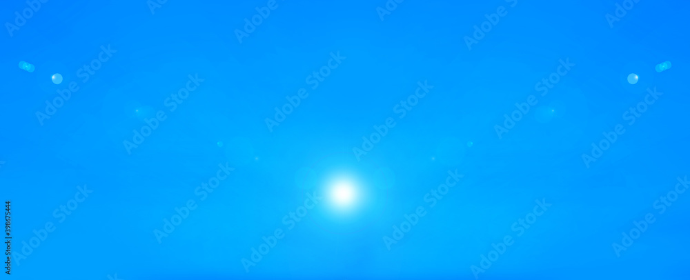 Blue sky and glare of rays in different directions from the star of the sun or moon. Illustration for inserting text. Blue sky and glare of rays in different directions from the star of the sun or moon. Illustration for inserting text.
