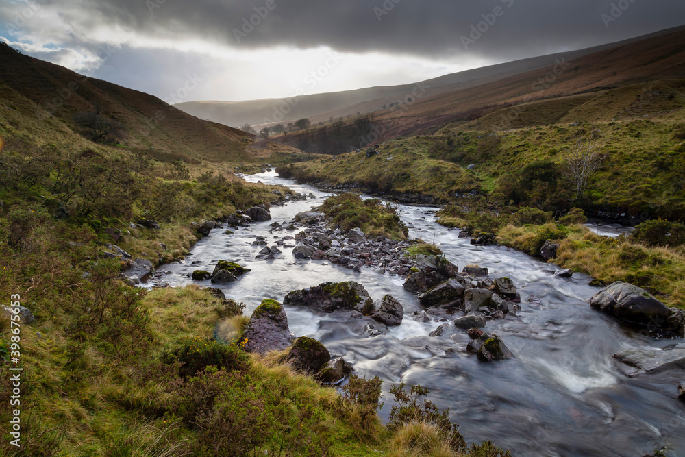 Rainclouds over the river Tawe in the Brecon Beacons in South Wales UK

