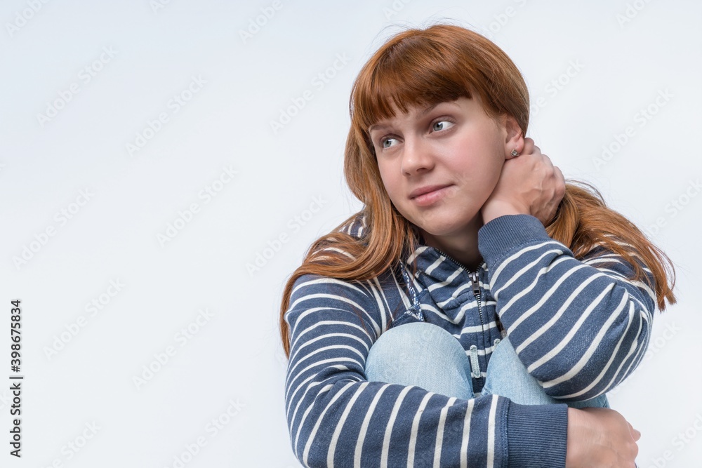 Woman in jeans and striped sweatshirt Woman in jeans and striped sweatshirt