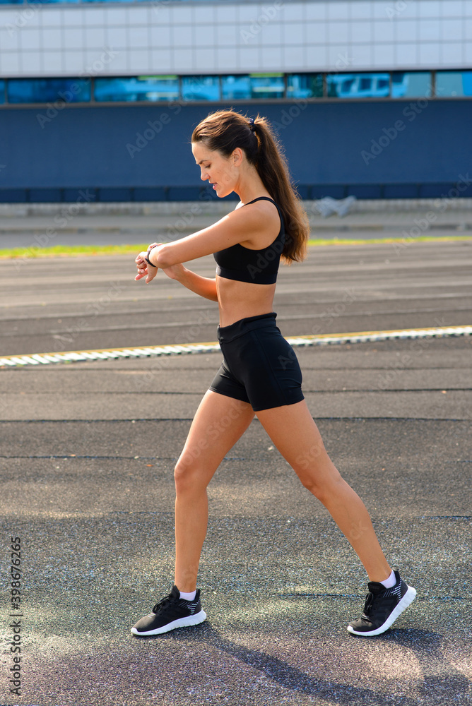 Athlete runner running on athletic track training her cardio.