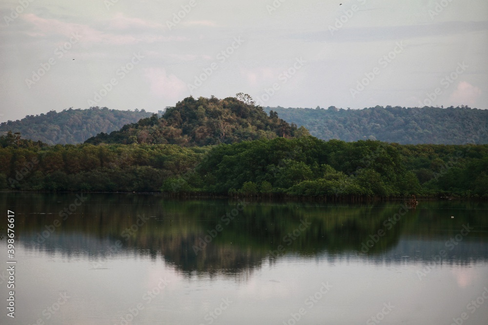 The hills are reflected in the lake The hills are reflected in the lake