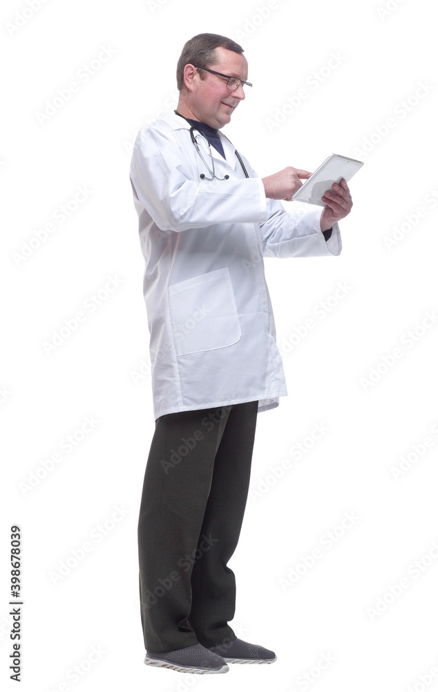 side view. doctor with a stethoscope using a digital tablet. side view. doctor with a stethoscope using a digital tablet.