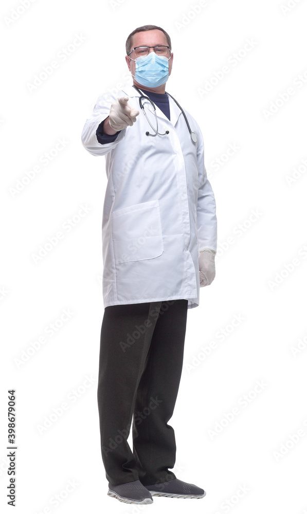 in full growth. doctor in a protective mask pointing at you . in full growth. doctor in a protective mask pointing at you .