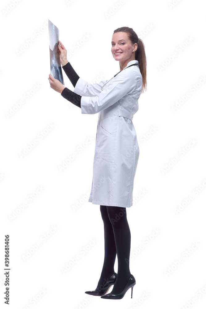 side view. smiling woman doctor looking at an x-ray. side view. smiling woman doctor looking at an x-ray.