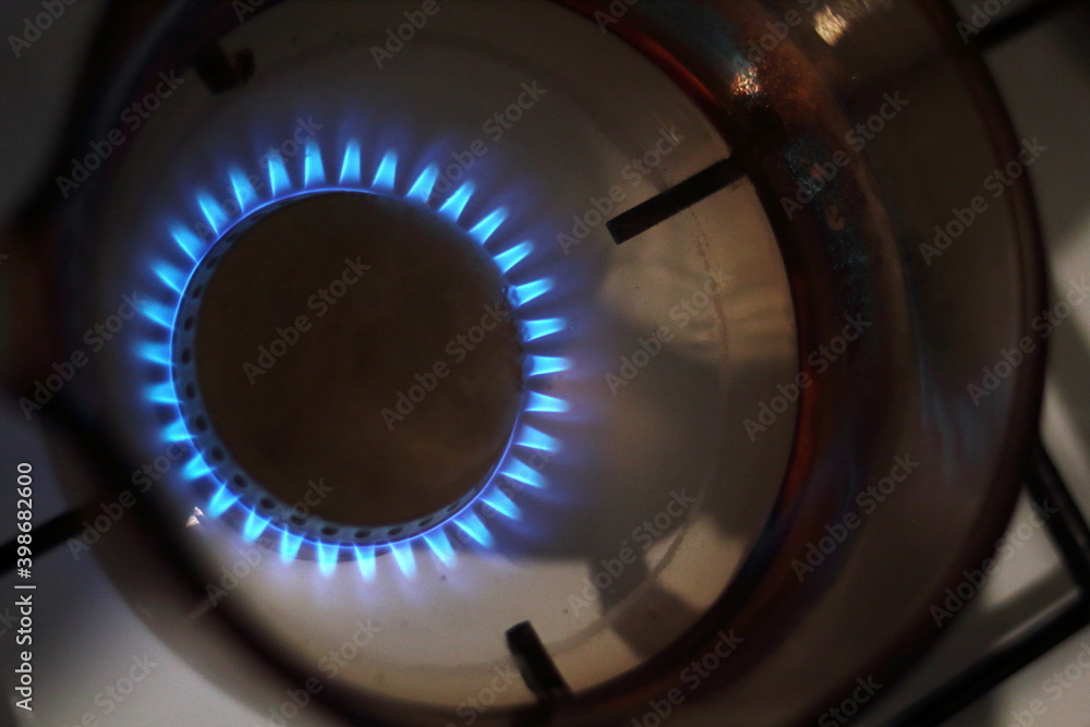 Empty Glass Water Dipper on Burning Gas Empty Glass Water Dipper on Burning Gas