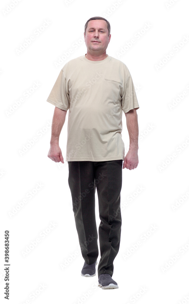 in full growth. a man in a light t-shirt striding forward. in full growth. a man in a light t-shirt striding forward.