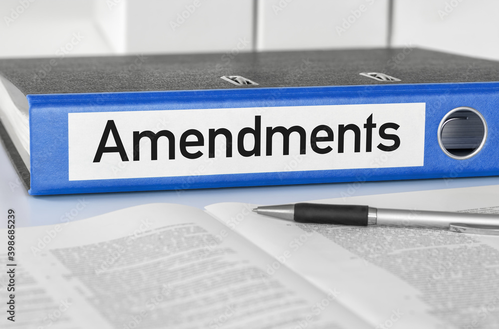 Naklejka premium A blue folder with the label Amendments