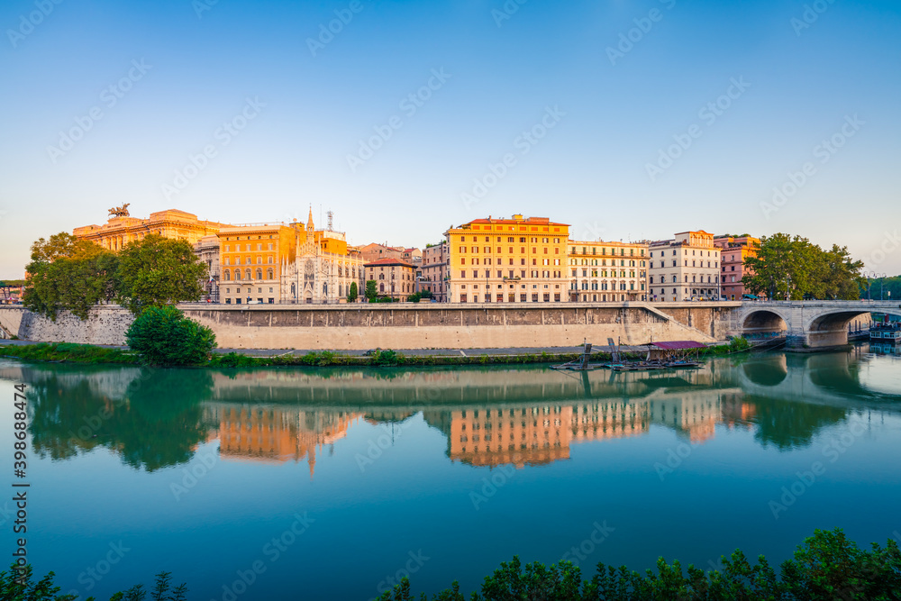 Panoramic view of Tiber riverside with Church of the Sacred Heart of Jesus in Prati and mirror reflection in the morning in Rome, Italy