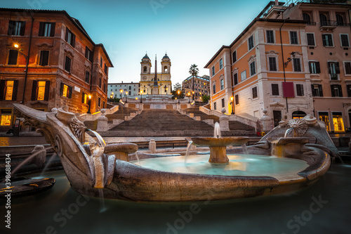 Fountain on the Piazza di Spagna square and the Spanish Steps in Rome at dusk © Pawel Pajor