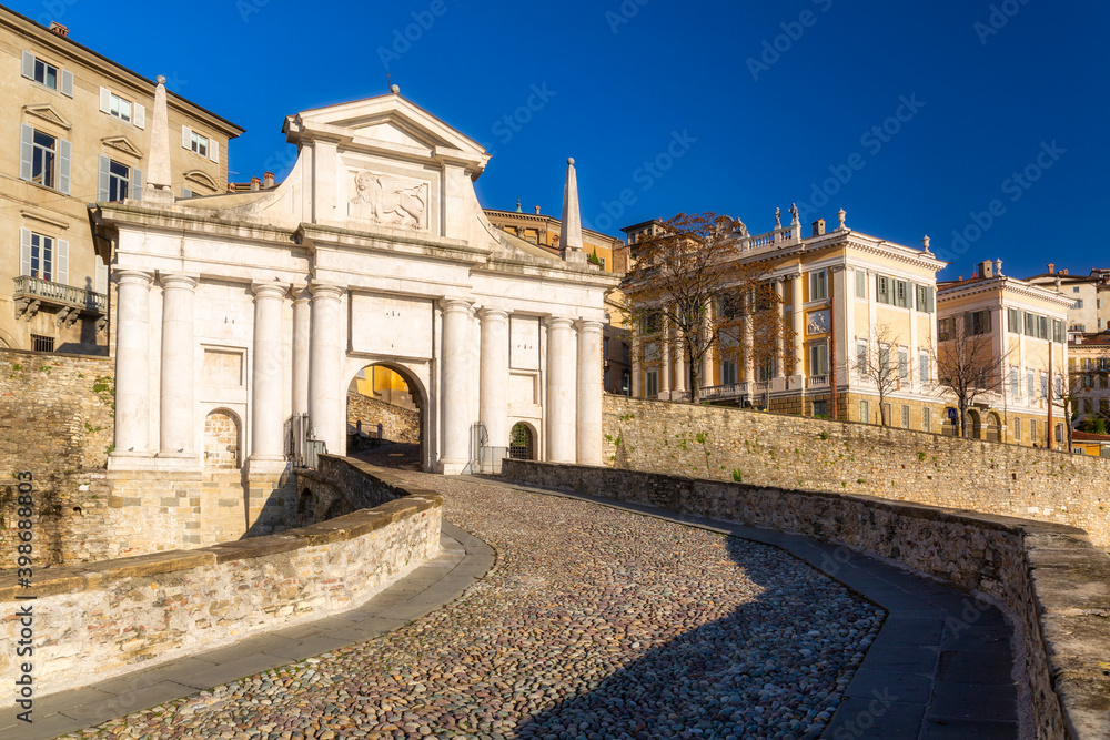 Beautiful Porta San Giacomo gate and the city walls of Citta Alta old town in Bergamo, Italy.