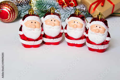 New year's background on a white desk decorated with toys, presents, Santa Claus. Bright colored background symbolizes the new year celebration. Great useful template to wright words down. photo