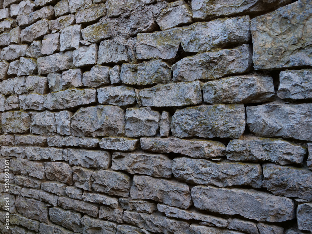 A stone of wall at Pesmes, a small village in Burgundy. A stone of wall at Pesmes, a small village in Burgundy.