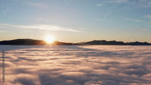 Wallpaper Mural Dramatic sunrise in mountains with low fluffy clouds covering valley from aerial view. Torontodigital.ca