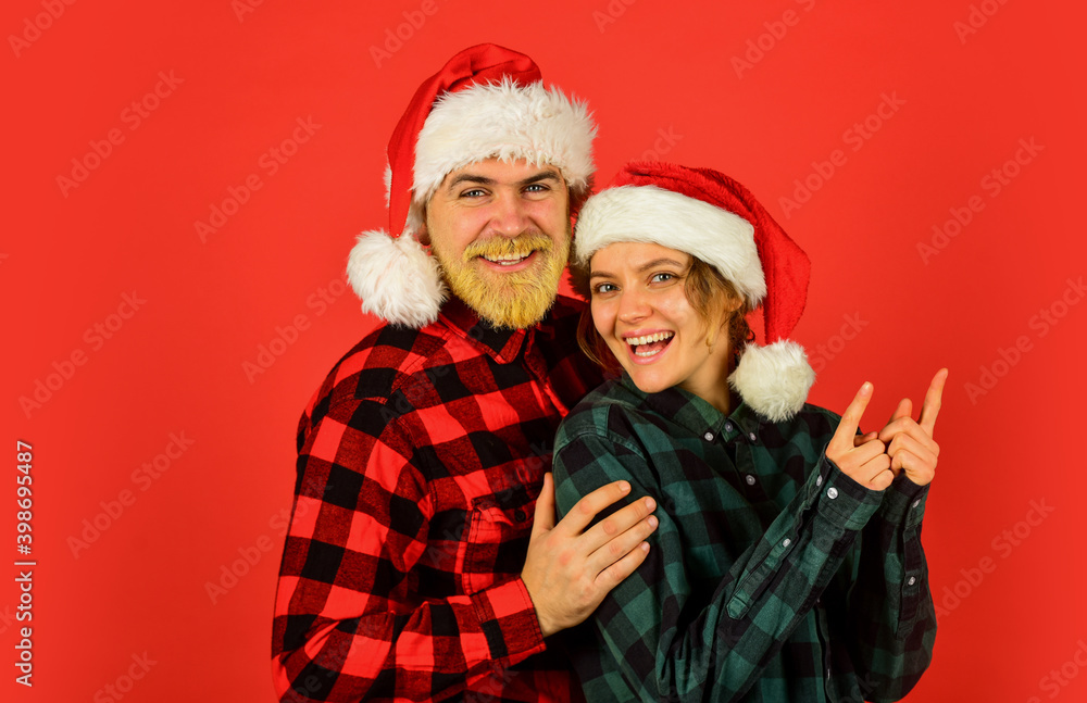 Family shopping. Christmas party. Couple in love cuddling. Good mood. Couple goals. Winter entertainment. Santa Claus style. Having fun. Christmas time. Man and woman christmas holiday celebration Family shopping. Christmas party. Couple in love cuddling. Good mood. Couple goals. Winter entertainment. Santa Claus style. Having fun. Christmas time. Man and woman christmas holiday celebration