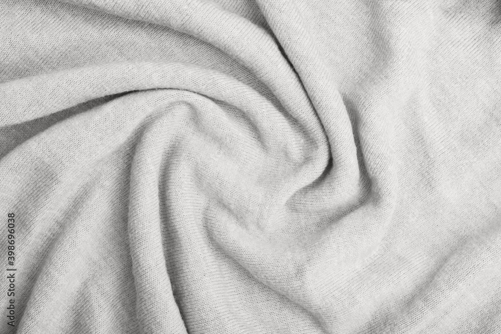 Close up of grey knitted textured background. Trendy color. Color 2021. Close up of grey knitted textured background. Trendy color. Color 2021.