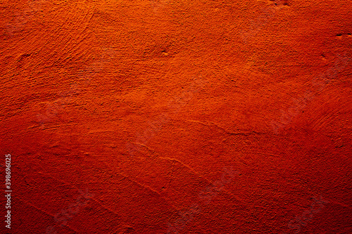 Orange colored abstract wall background with textures of different shades of orange
