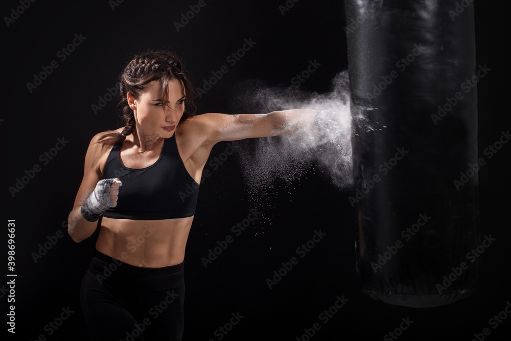 A female gymnast on gymnastic canvases