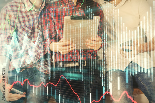 Double exposure of forex graph drawing and man and woman working together holding and using a mobile device. Trade concept.