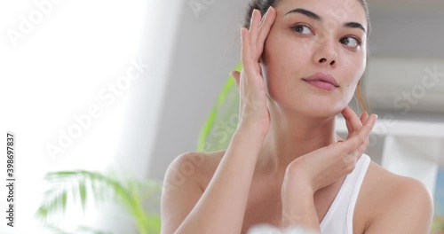 woman applying makeup on her face