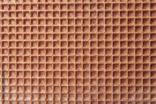 Empty wafer texture as background. Closeup view of chocolate waffle. Top view