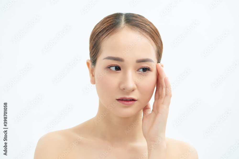 Portrait of tired and upset Asian woman over white background Portrait of tired and upset Asian woman over white background
