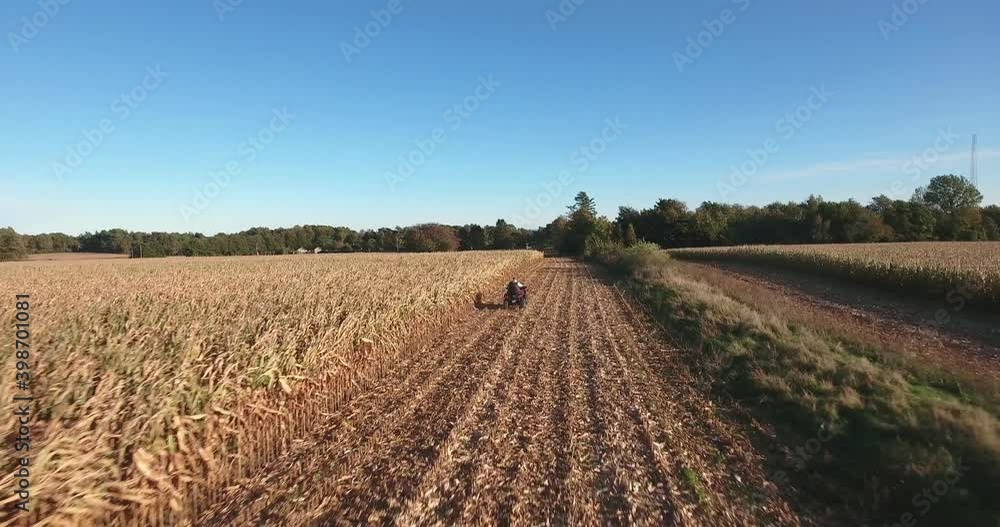 Quad Bike Driving Fast on a Field in South Sweden Skåne in Borrby Österlen, Aerial Following Quad Bike Driving Fast on a Field in South Sweden Skåne in Borrby Österlen, Aerial Following