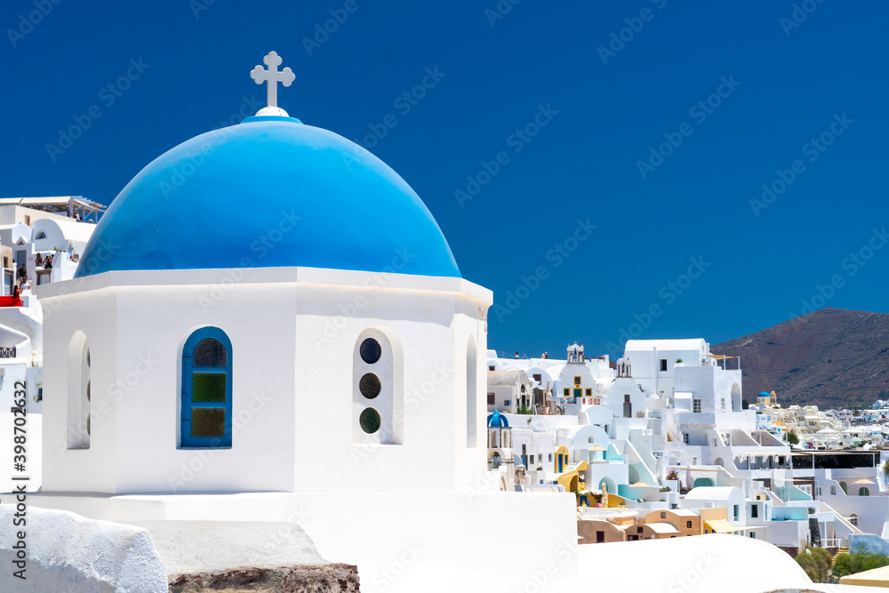 Traditional greek church and white architecture on Santorini island, Greece. Famous travel destination