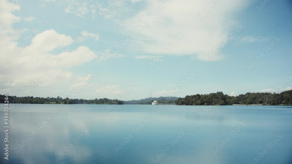 Timelapse of river and sky that is separated by forests on the horizon Timelapse of river and sky that is separated by forests on the horizon