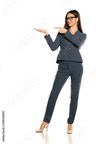 beautifu advertizing business woman in a pants and jacket