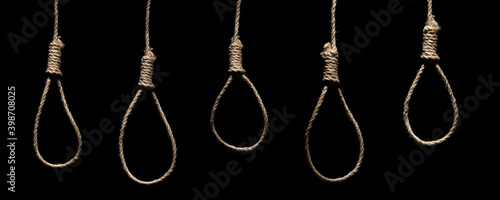 Fotografija Creative social concept photo of rope noose with hangman's knot hanging in front of black background