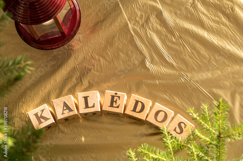 Kaledos - Lithuanian word for Christmas - arranged from wooden blocks with letters. photo