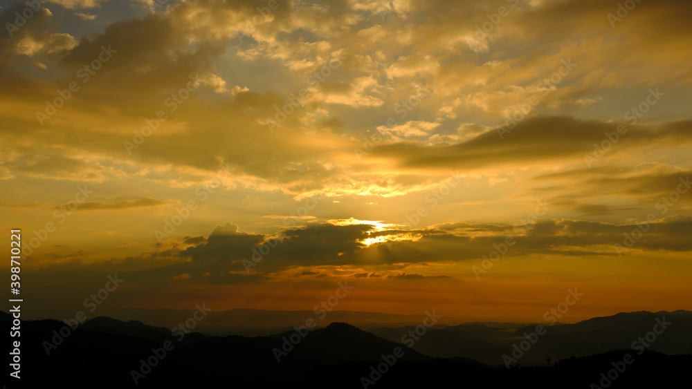 Fantastic mountains glowing by sunlight bean effect at evening Fantastic mountains glowing by sunlight bean effect at evening