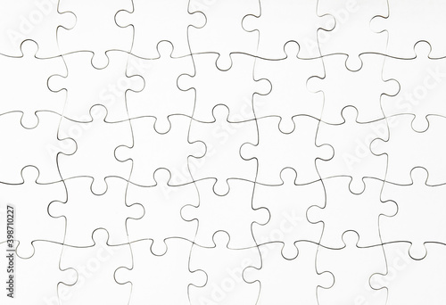 Close up view of white jigsaw puzzle mockup photo