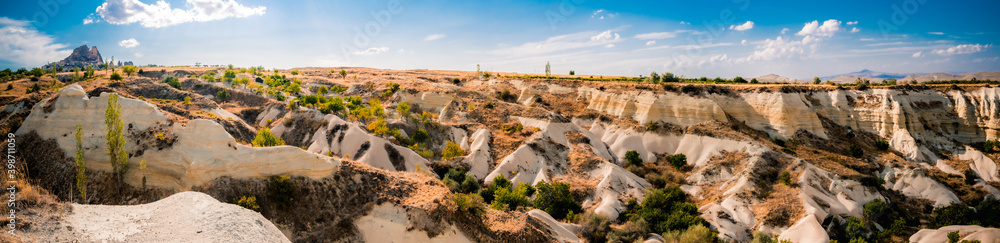 Panoramic view of turkish landscape with unusual sand mountains near Uchisar in Cappadocia Panoramic view of turkish landscape with unusual sand mountains near Uchisar in Cappadocia