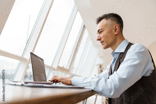 Confident handsome businessman in smart clothes