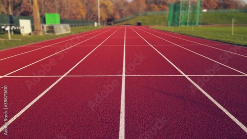 Aerial footage of running track in a sport stadium. first person view of a runner in a competition. Victory at the finishing line.