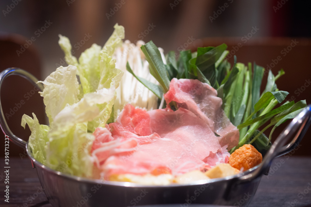 Shabu Shabu or Sukiyaki, a popular dish of pork, beef and fresh vegetables. Shabu Shabu or Sukiyaki, a popular dish of pork, beef and fresh vegetables.
