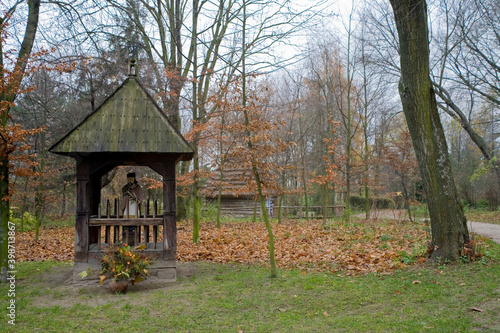 autumn landscape with a wooden chapel in the countryside in Polish Podlasie