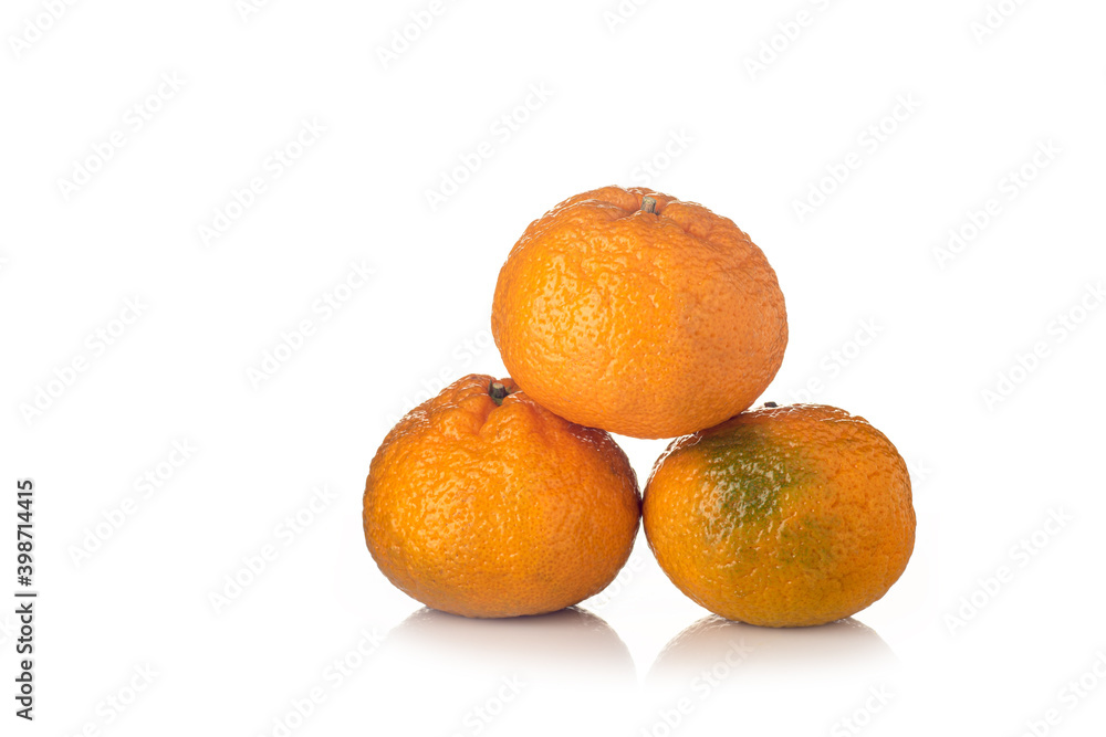 Tangerine with slices on a white background with reflection Tangerine with slices on a white background with reflection