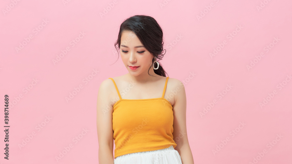 Picture of cute young smiling lady standing isolated over pink background Picture of cute young smiling lady standing isolated over pink background